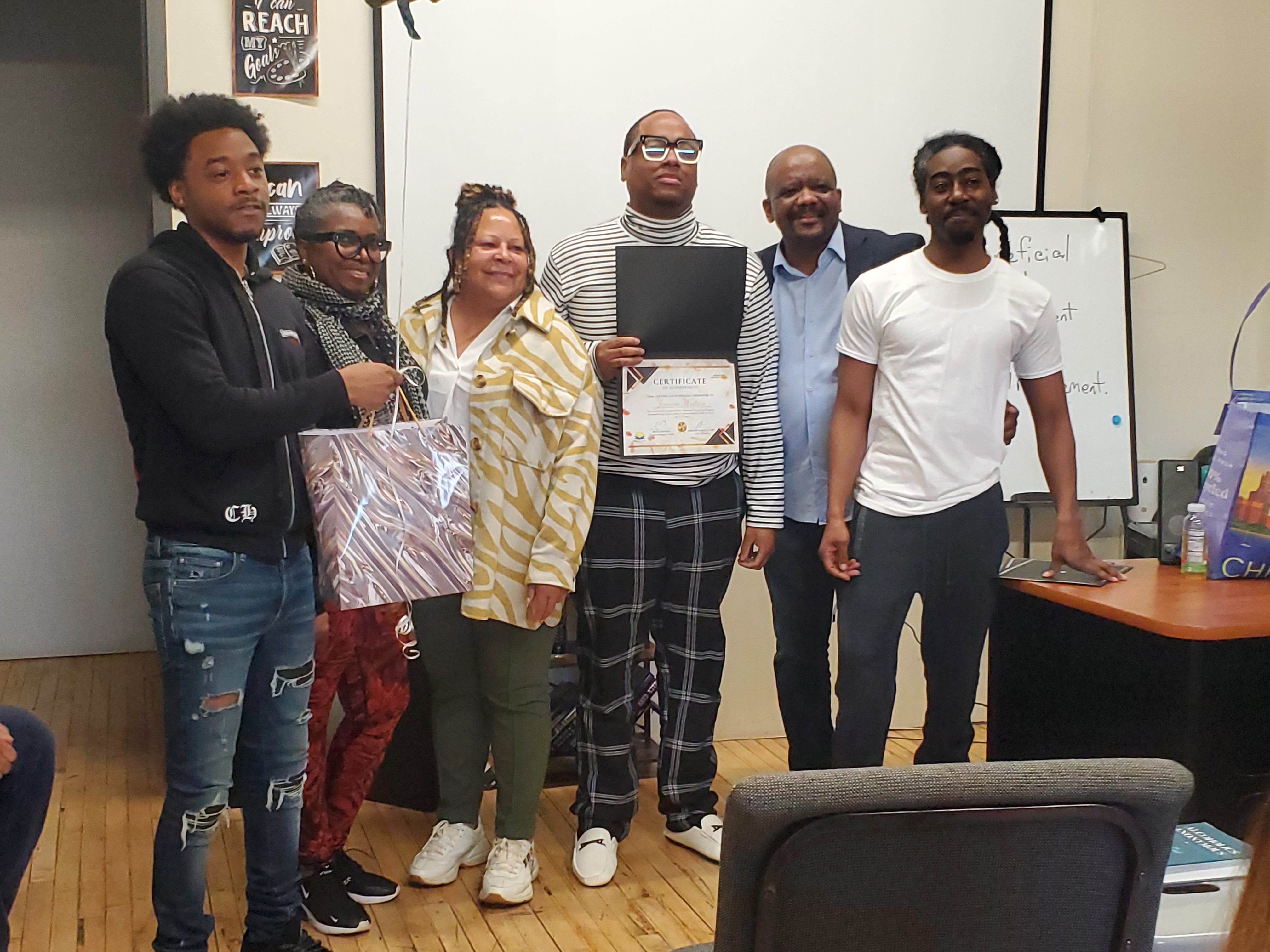Graduate holding certificate folder