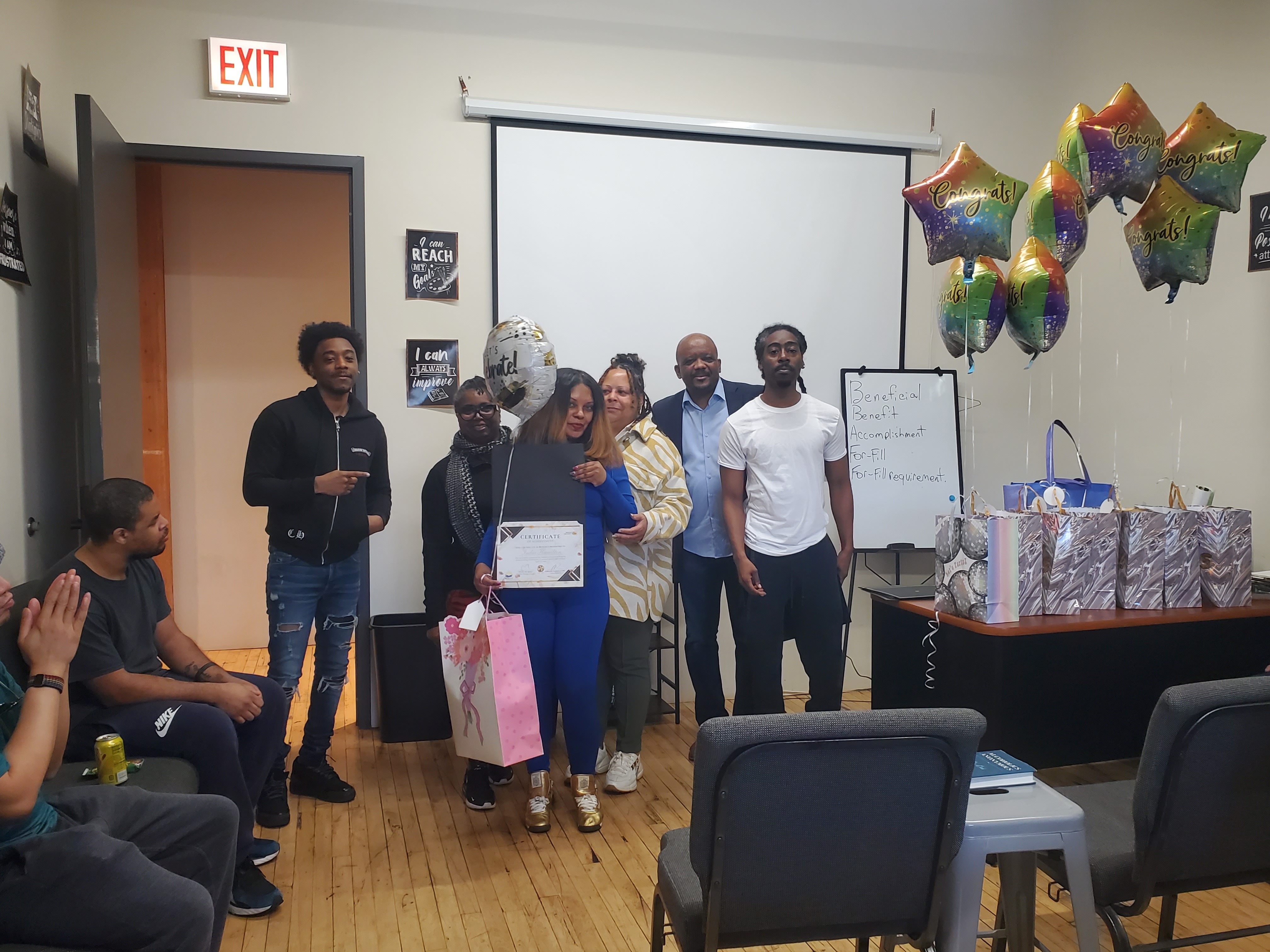 Graduation ceremony — certificate presentation with the full group