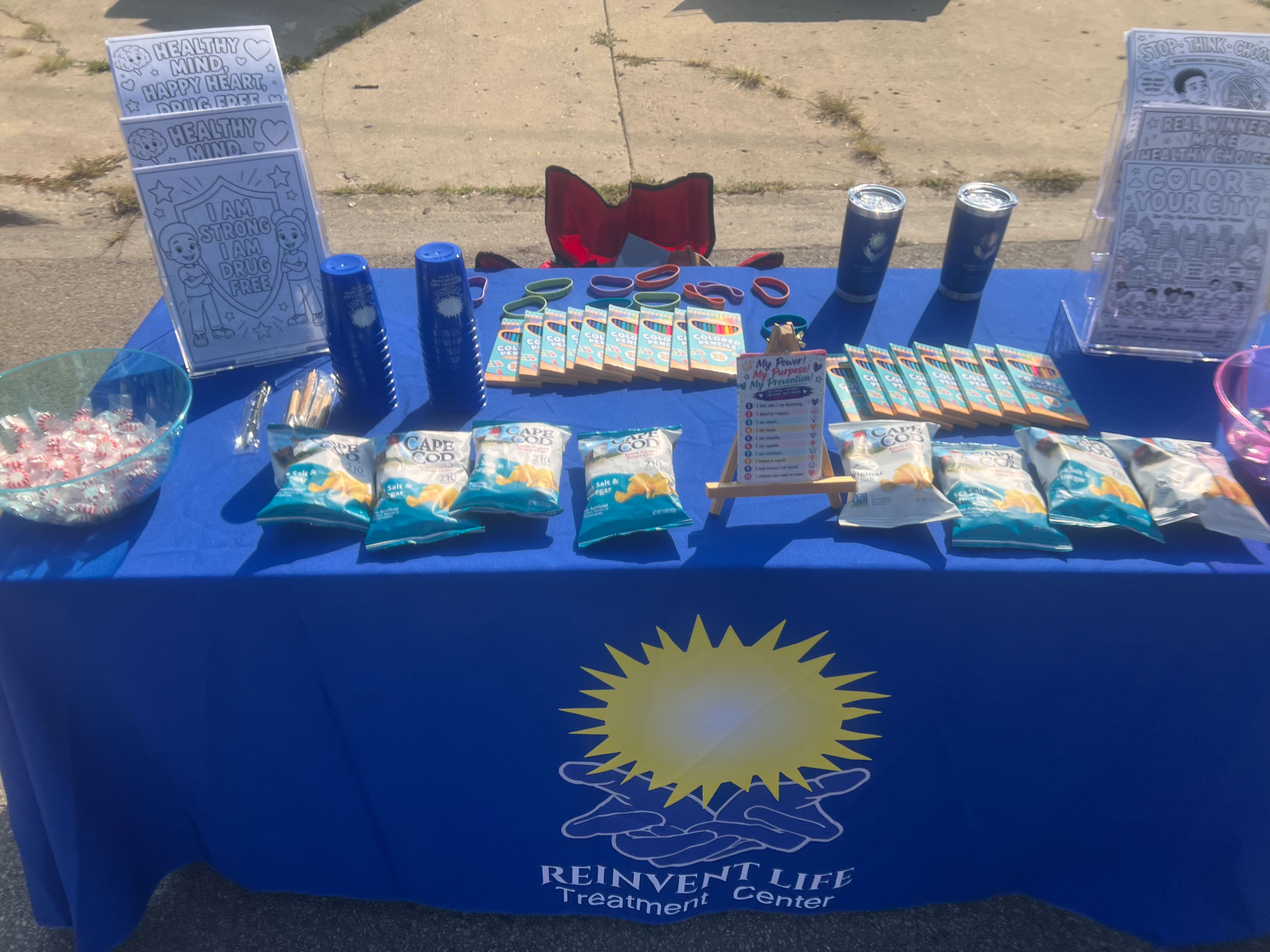 Reinvent Life table with prevention materials and giveaways
